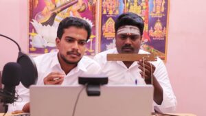 Nadi readers conducting a live online palm leaf reading at a studio desk
