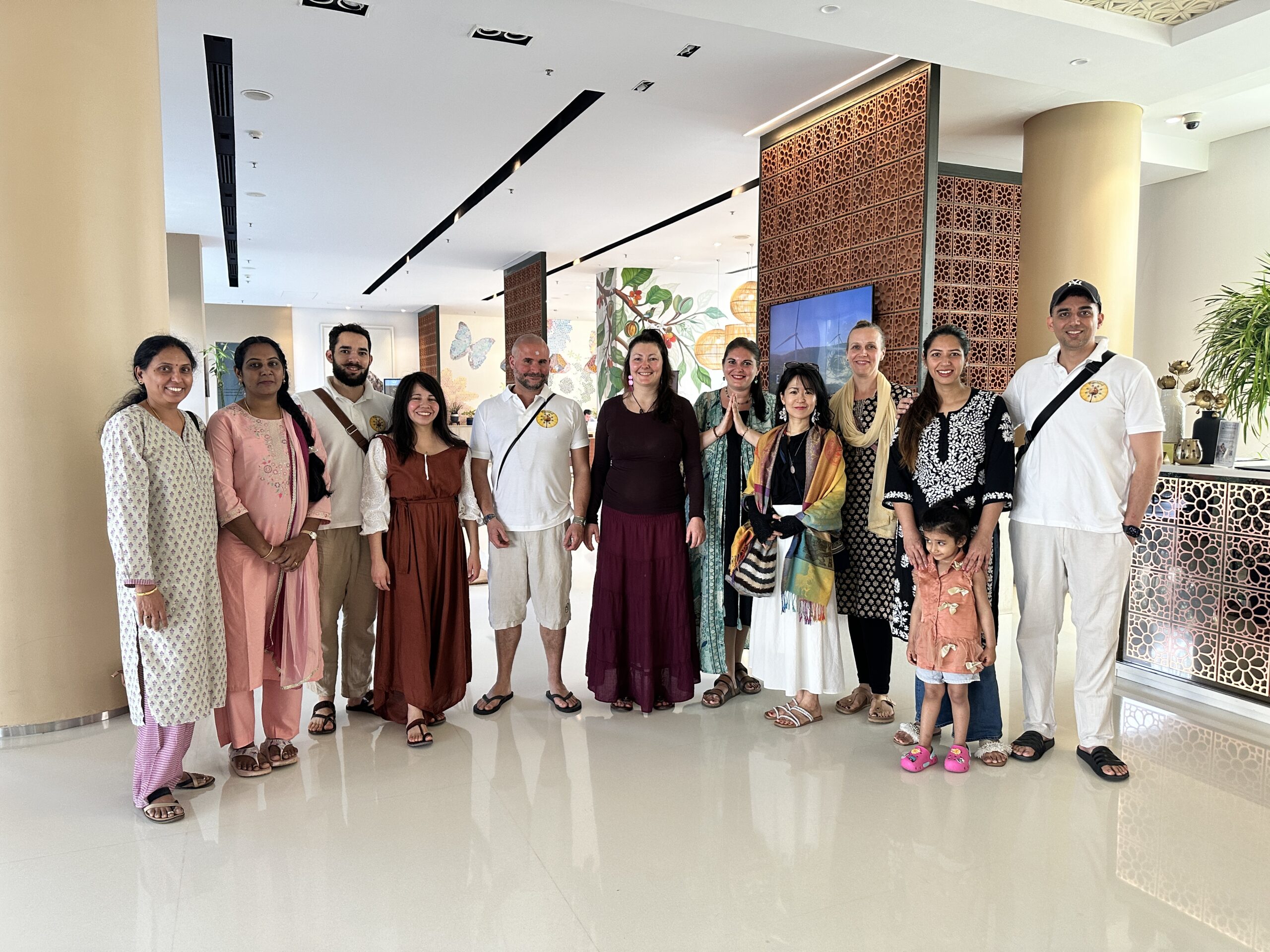 Mypalmleaf travel group gathered in a hotel lobby in India